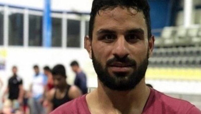 مزاعم جديدة للقضاء الإيراني بشأن إعدام بطل المصارعة ووالده يبعثان برسالة