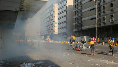 العراق.. مواجهات في بغداد واتهامات لميليشيات "الصـدر" باغتيال ناشطين